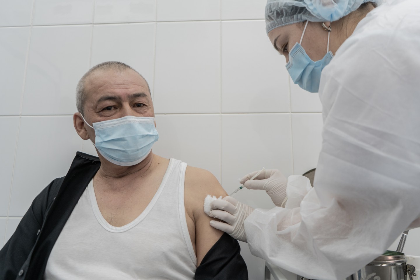 People receive a dose of coronavirus Sputnik V vaccine at clinics and certain application centers allocated in shopping malls in Nur Sultan, Kazakhstan on April 13, 2021.