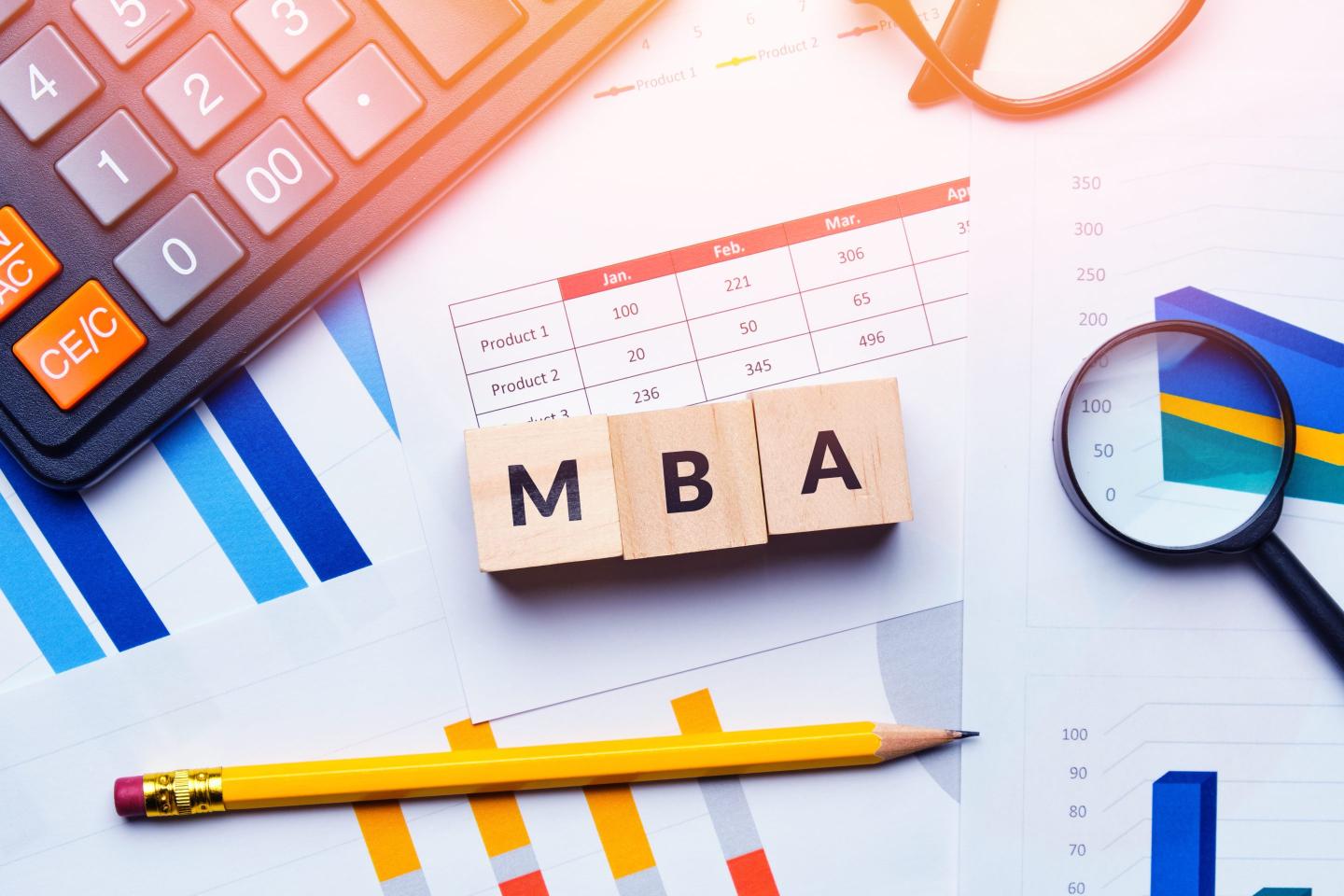 Scrabble-like tiles display "MBA" while concept items—pencil, paper, and charts—surround it.