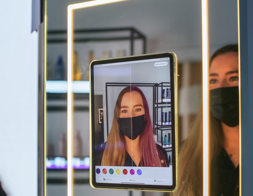 Amazon's first hair salon, in London, lets customers try different hair shades using augmented reality.