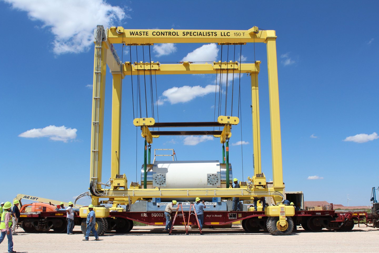 Workers off-loading a rail transportation cask containing nuclear waste from the Vermont Yankee Nuclear Power Station, which is being decommissioned by NorthStar.