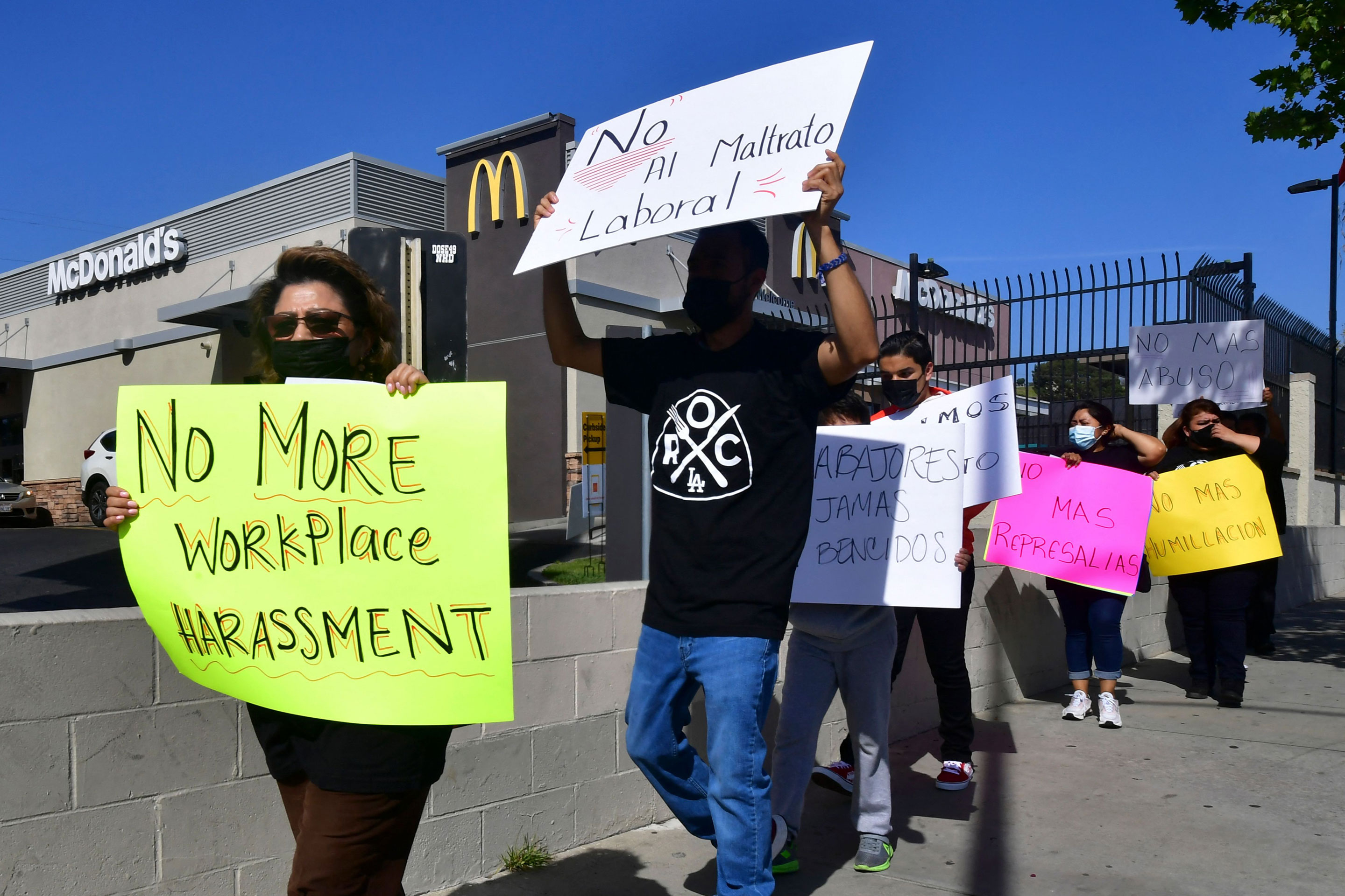McDonald's employees protest outside their workplace on April 9, 2021.
