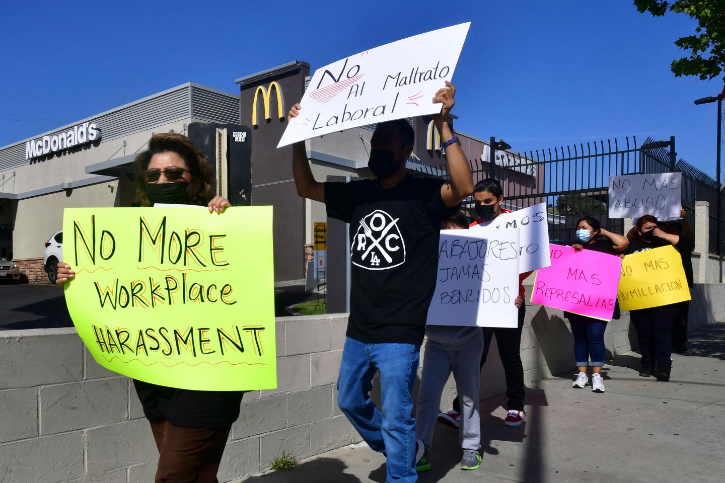 McDonald's employees protest outside their workplace on April 9, 2021.