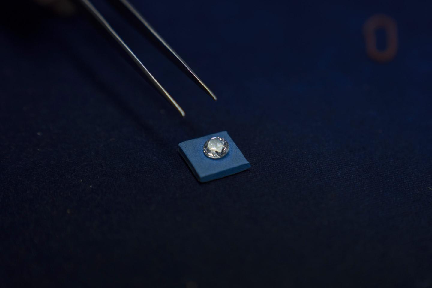 Worker prepares to pick up a diamond