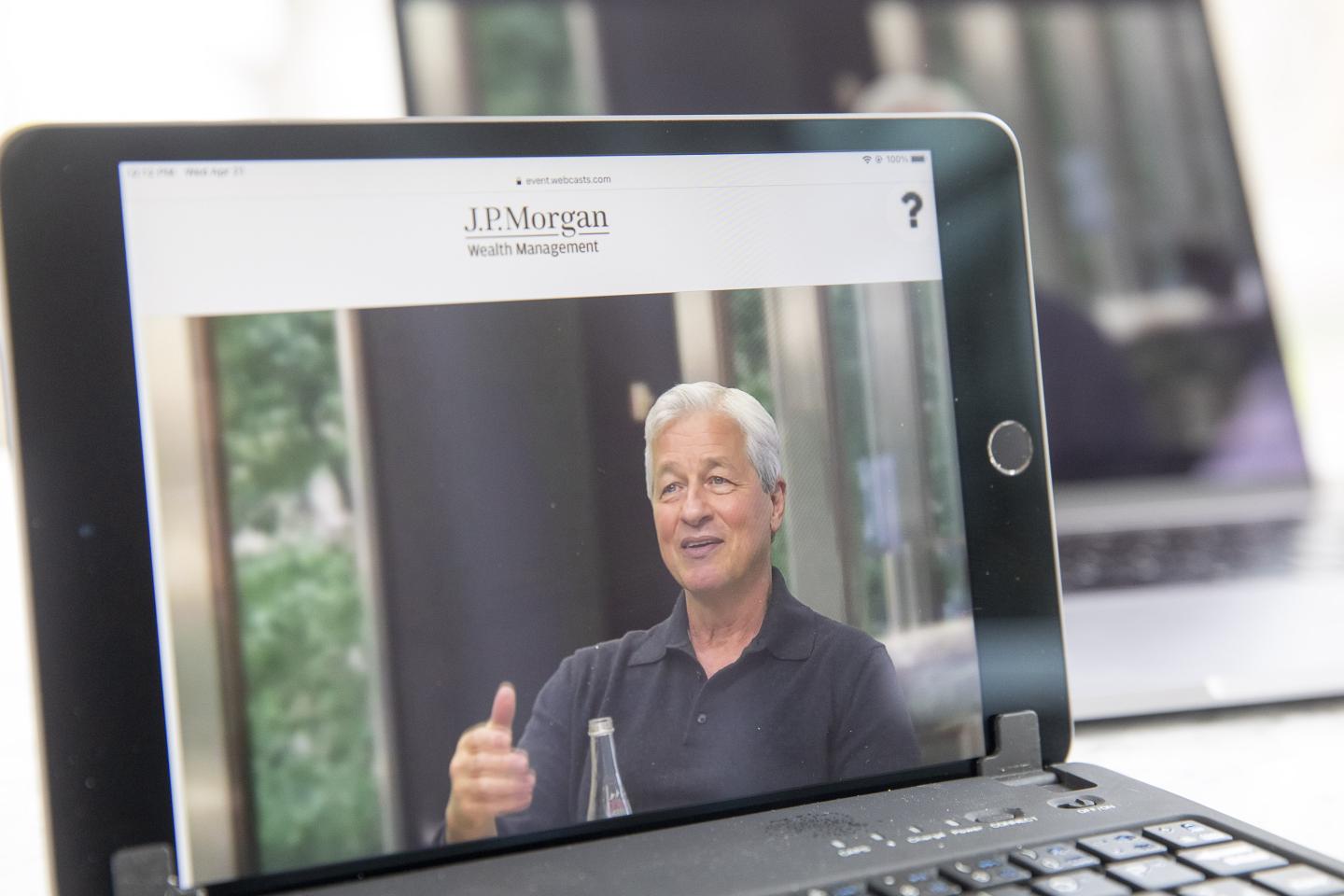 Jamie Dimon, chief executive officer of JPMorgan Chase &amp; Co., speaks virtually during a webcast event on a tablet computer in Tiskilwa, Illinois, U.S., on Wednesday, April 21, 2021.