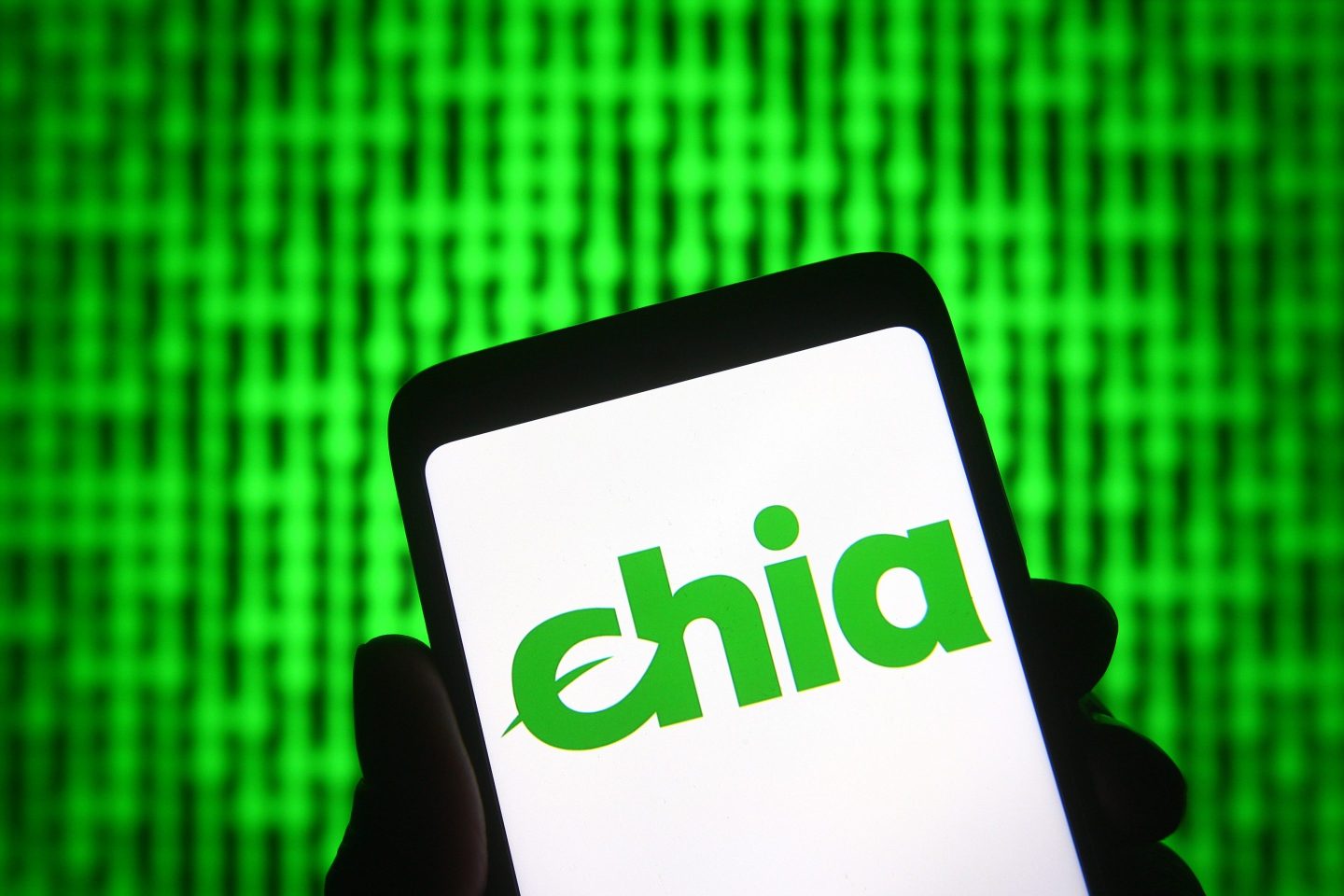 UKRAINE &#8211; 2021/04/23: In this photo illustration, Chia sign of a new cryptocurrency is seen on a smartphone and a pc screen. (Photo Illustration by Pavlo Gonchar/SOPA Images/LightRocket via Getty Images)