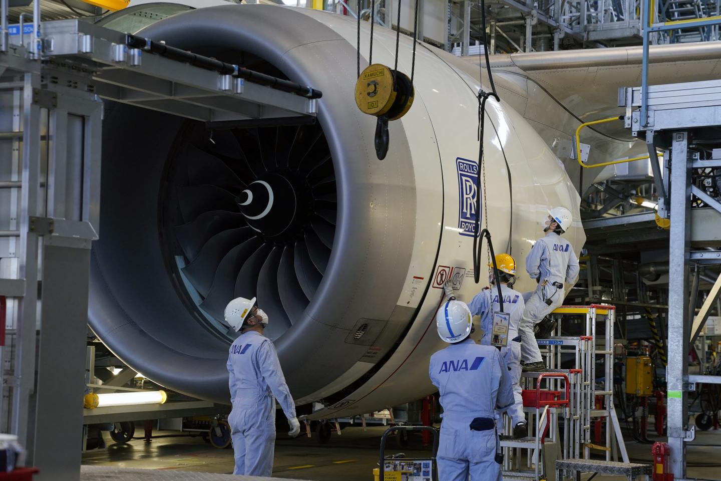 Rolls-Royce engines on an airliner undergoing maintenance at Tokyo’s Haneda Airport. Rolls-Royce has used A.I. to offer customers predictive maintenance services, which improve the reliability of their engines.