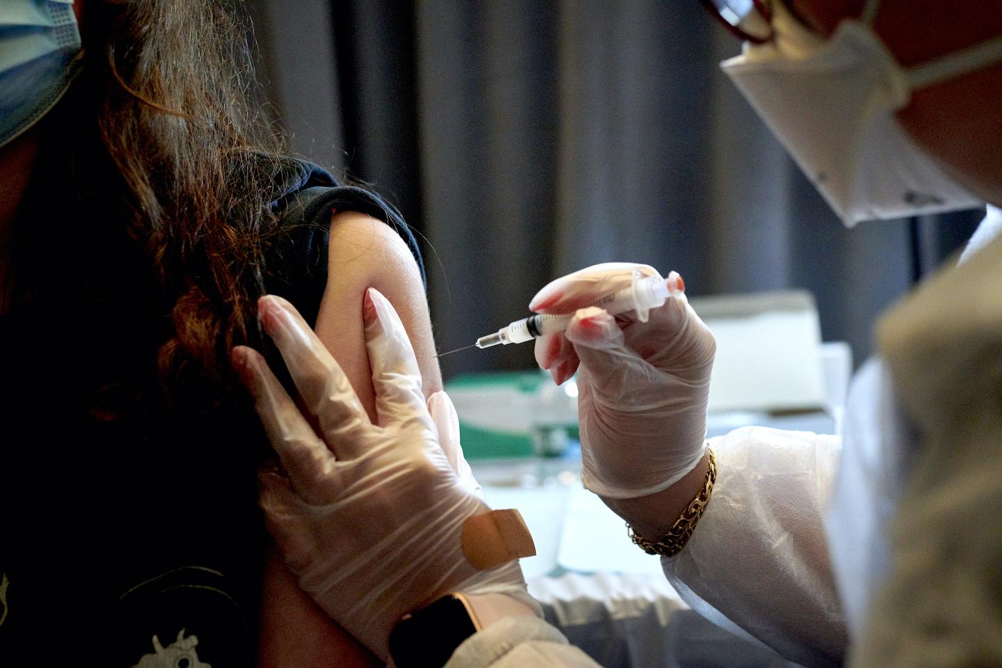 Some Americans who have reported vaccine side effects hope the U.S. will cover their medical costs