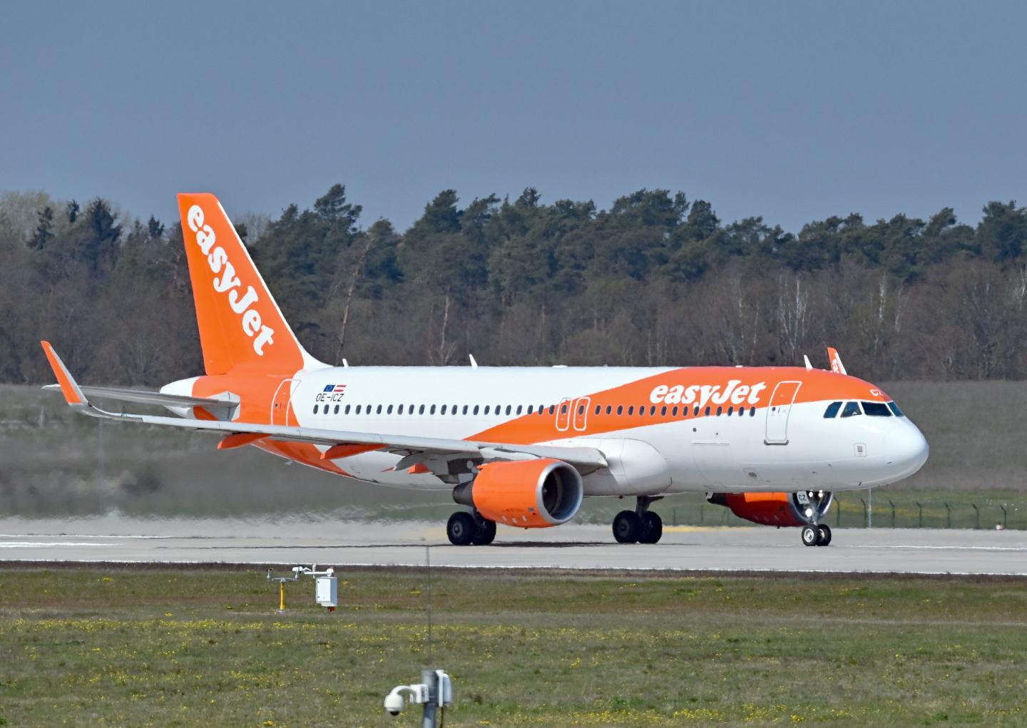 EasyJet plane on a runway.
