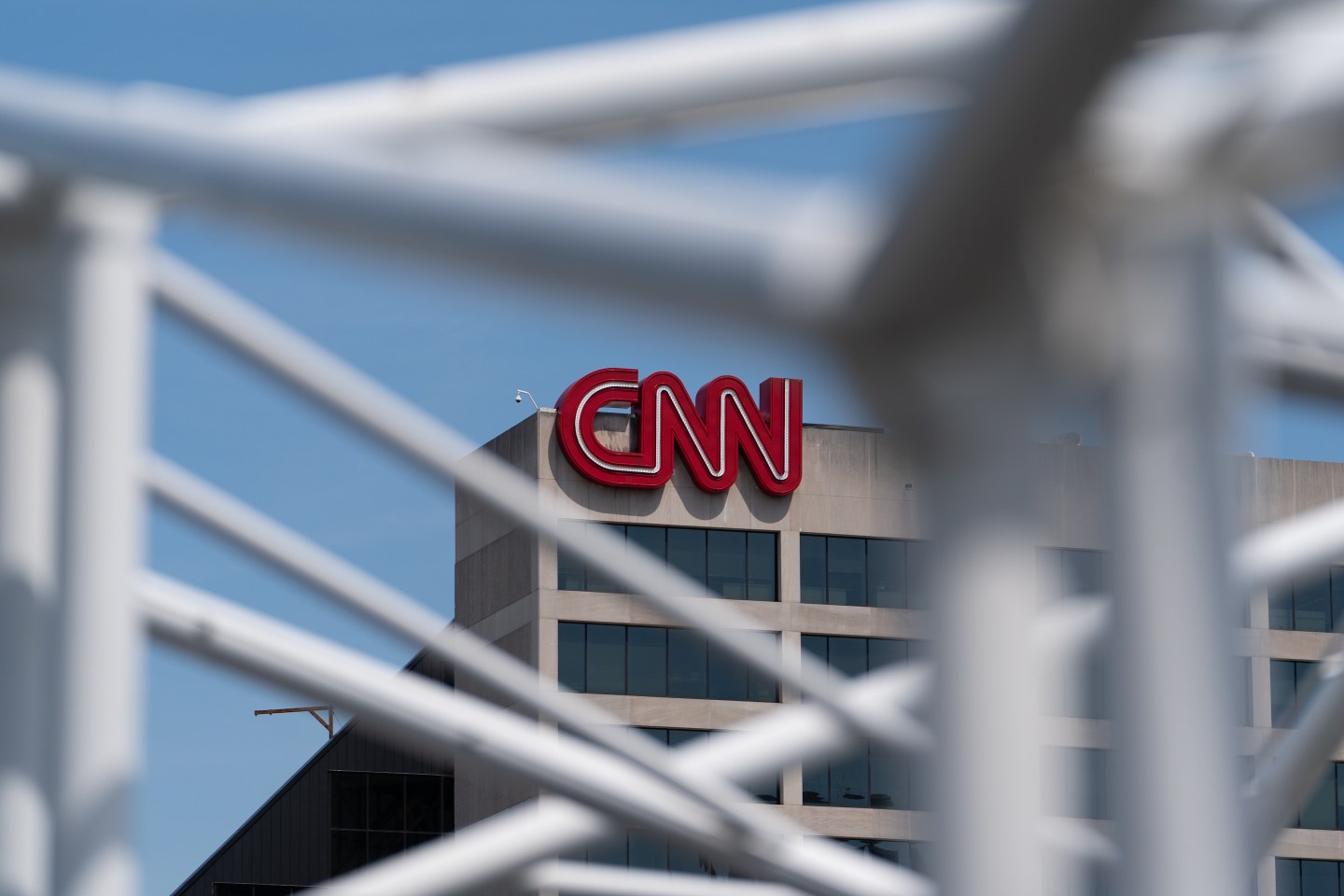 The CNN building in Atlanta, Georgia, U.S., on Monday, May 17, 2021. AT&amp;T Inc. agreed to spin off its media operations in a deal with Discovery Inc. that will create a new entertainment company, merging assets ranging from CNN and HBO to HGTV and the Food Network. Photographer: Elijah Nouvelage/Bloomberg