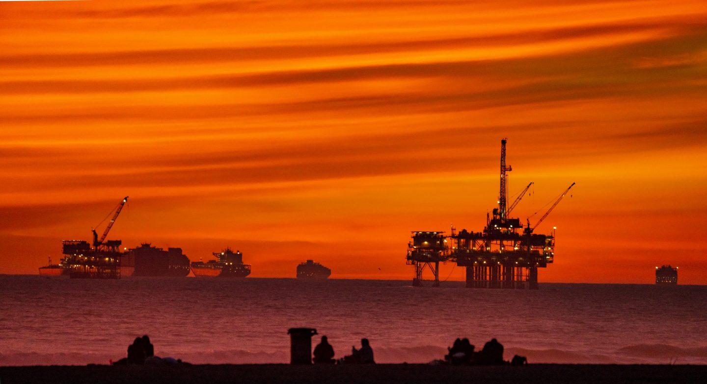 HUNTINGTON BEACH, CA - JANUARY 14: The sun sets over container ships and oil platforms off the coast of Huntington Beach on Tuesday, January 12, 2021. (Photo by Leonard Ortiz/MediaNews Group/Orange County Register via Getty Images)