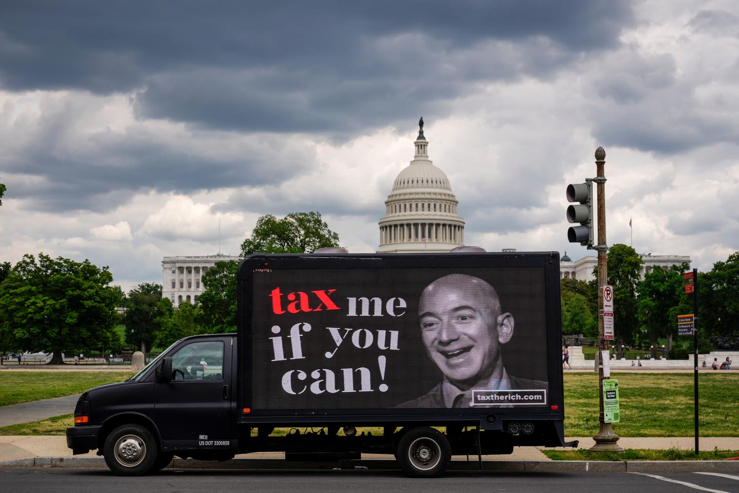 A mobile billboard calling for higher taxes on the ultra-wealthy depicts an image of billionaire businessman Jeff Bezos, near the U.S. Capitol on May 17, 2021 in Washington DC.