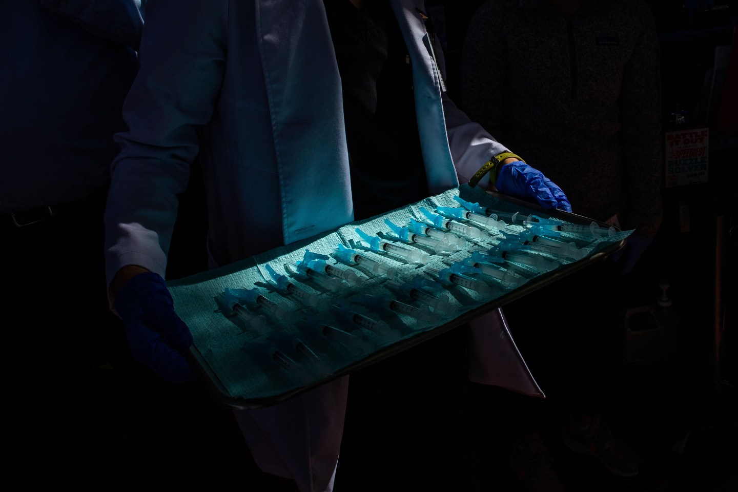 A medical assistant transports the Moderna Covid-19 vaccine ready to be administered at a vaccination site at Kedren Community Health Center, in South Central Los Angeles, California on February 16, 2021.