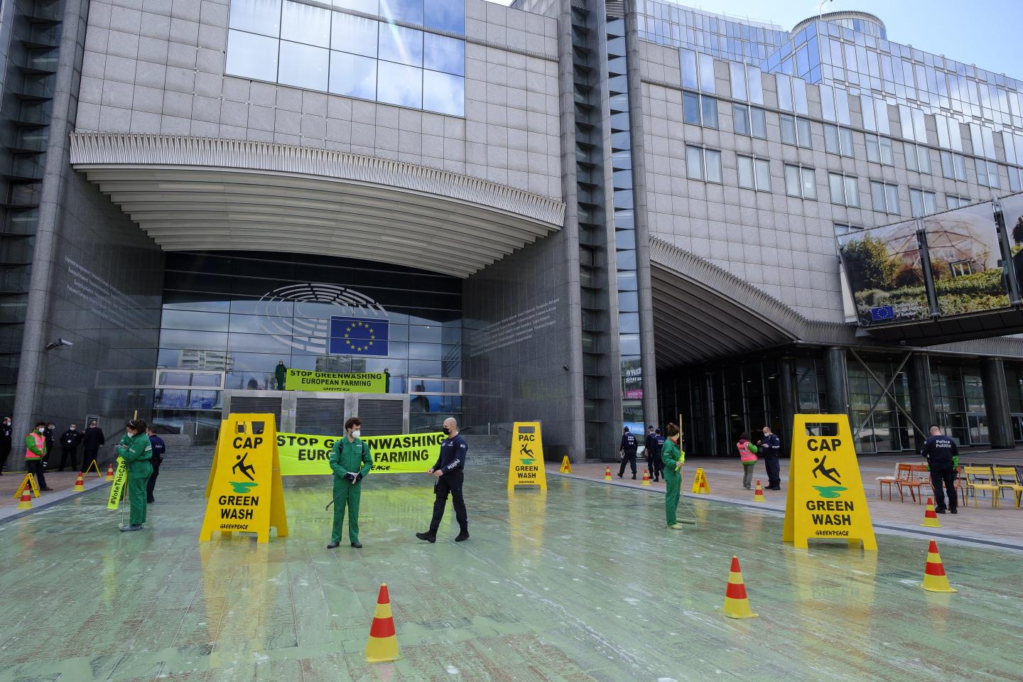 Activists Colour EU Parliament Green To Expose Greenwashing Of Farming Reform