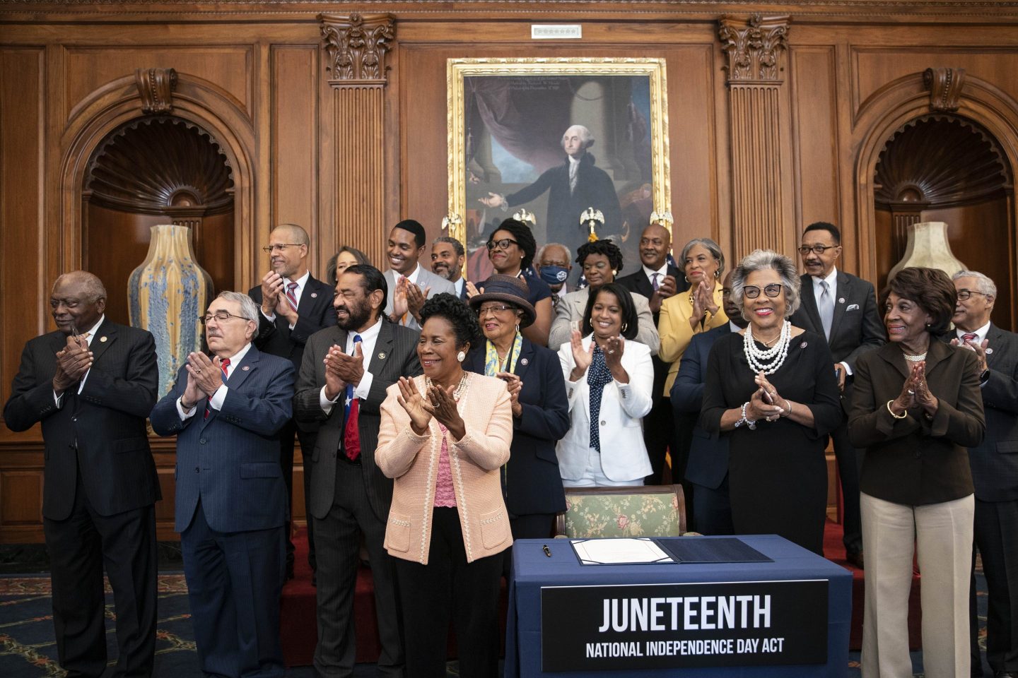 Members of the Congressional Black Caucus applaud at a bill enrollment ceremony for the Juneteenth National Independence Day Act at the U.S. Capitol in Washington, D.C.