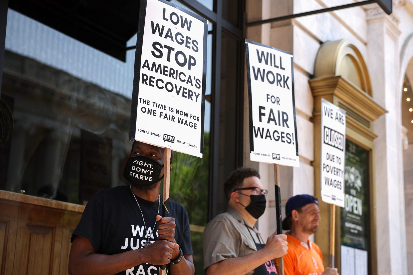 Activists rally for a higher minimum wage in Washington, D.C. “The costs of paying employees fairly can be substantial,” writes Andrei Cherny. “The costs of failing to do so are even greater.”