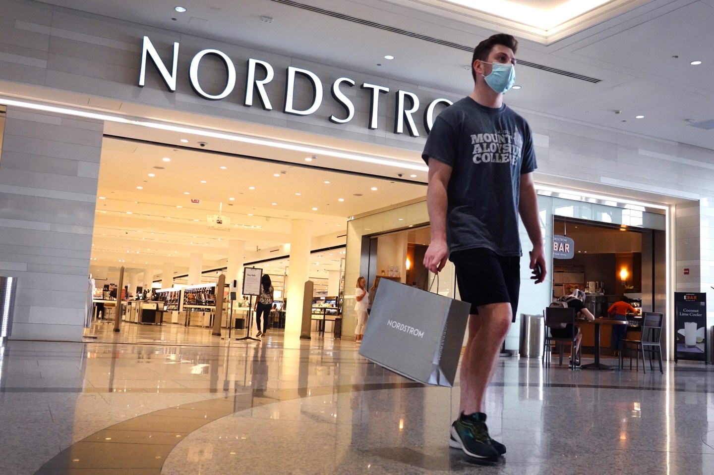 A shopper leaves a Nordstrom store on May 26, 2021 in Chicago, Illinois.