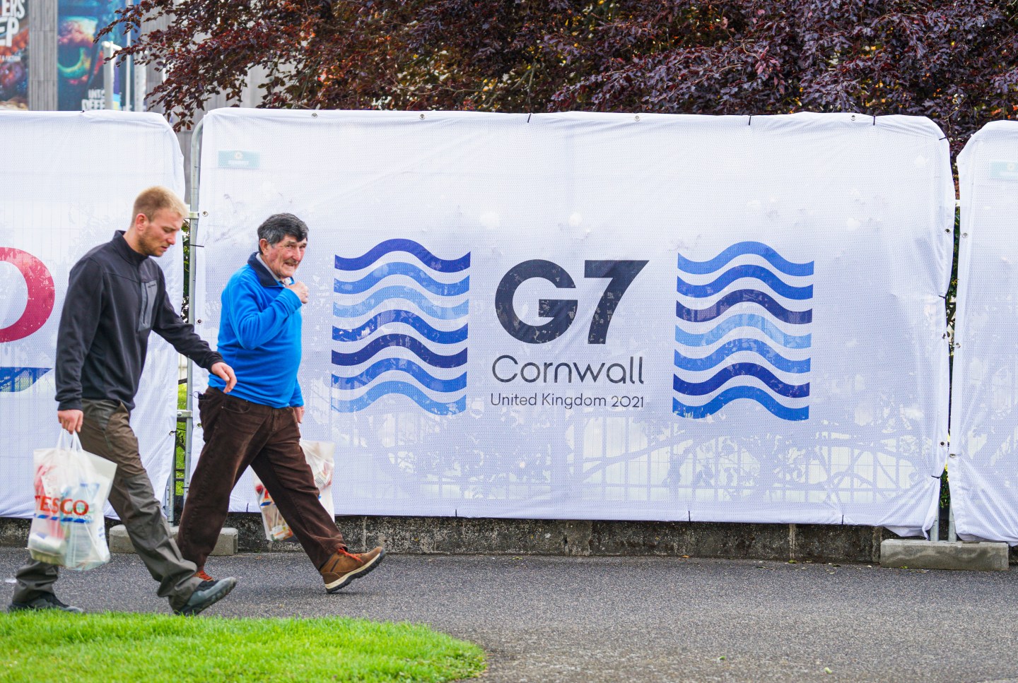 A member of the public walks passed G7 Summit signage erected outside the G7 media centre at the National Maritime Museum Cornwall, which is hosting the world’s media for the upcoming G7 Summit, on May 29, 2021 in Falmouth, England.