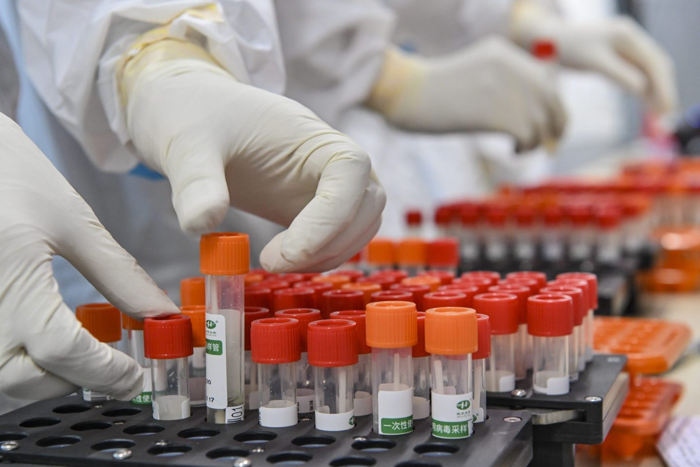 GUANGZHOU, CHINA &#8211; JUNE 03: Medical staffs check nucleic acid test samples in an air-inflated mobile COVID-19 test lab, known as the &#8220;Falcon labs&#8221;, in Guangzhou Gymnasium on June 3, 2021 in Guangzhou, Guangdong Province of China. (Photo by Chen Jimin/China News Service via Getty Images)