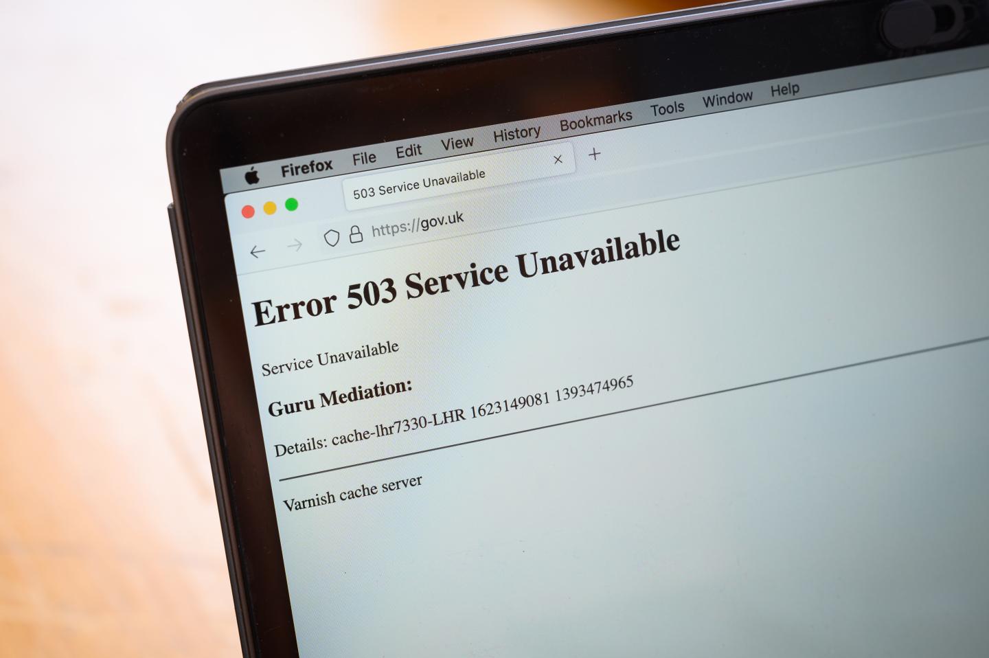 In this Photo illustration, a screen displays a holding page of the Gov.UK Government website portal on June 08, 2021 in London, England. A wide range of major websites including eBay, Paypal, The Financial Times, Reddit, Twitch and The Guardian were taken offline due to what is believed to be an issue with the Fastly cloud hosting service.