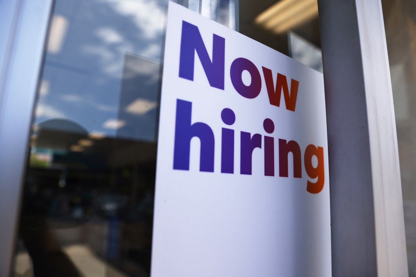 A 'Now hiring' sign is displayed at a FedEx location on June 23, 2021 in Los Angeles, California.