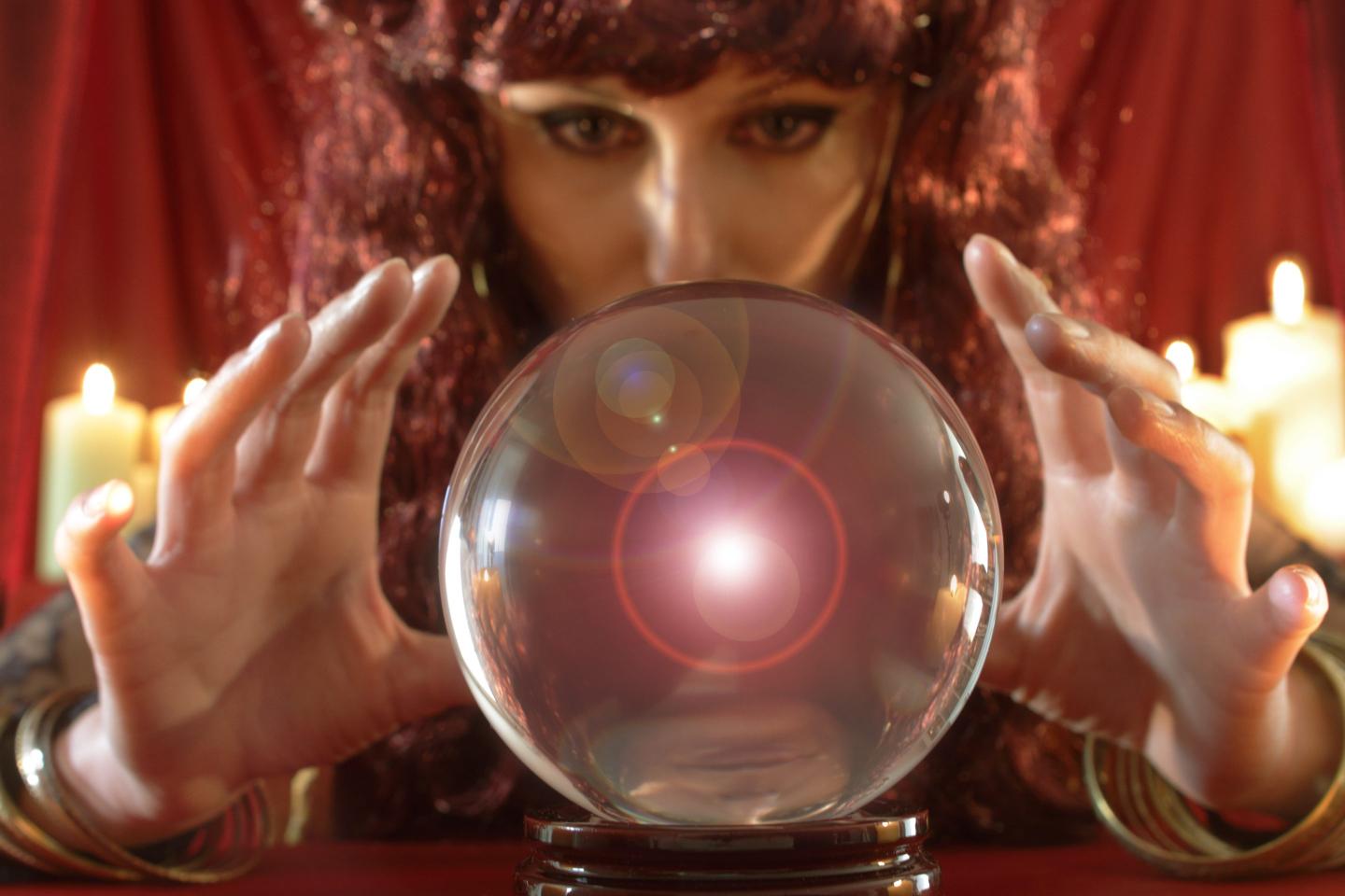 Image of a fortune teller staring into a crystal ball.