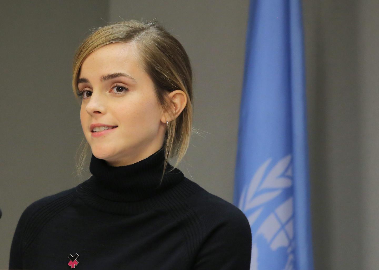 Actress Emma Watson standing at a podium at a UN event.