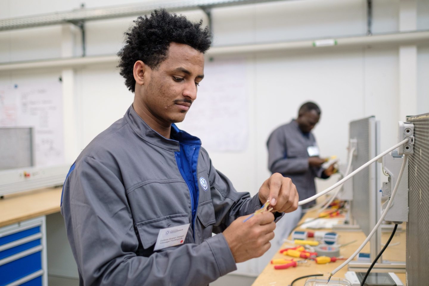 Men taking part in Volkswagen's refugee training program.