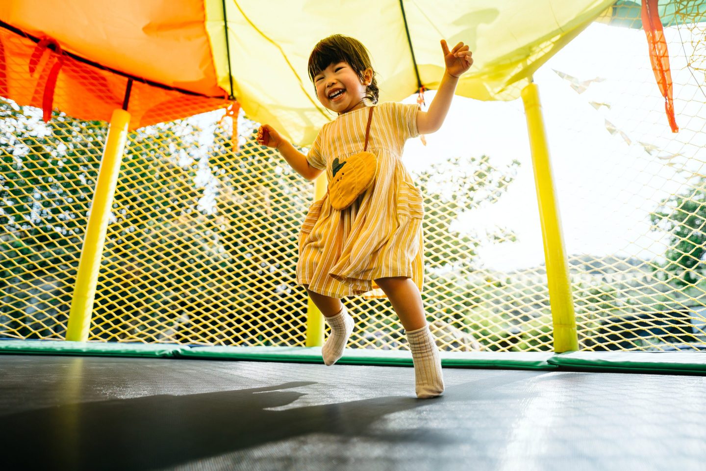 Child playing on a trampoline