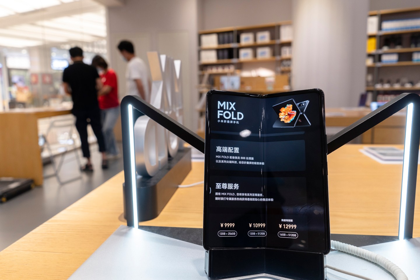 A brand-new smart phone with the foldable screen, named Mix Fold, is shown in a Xiaomi store.