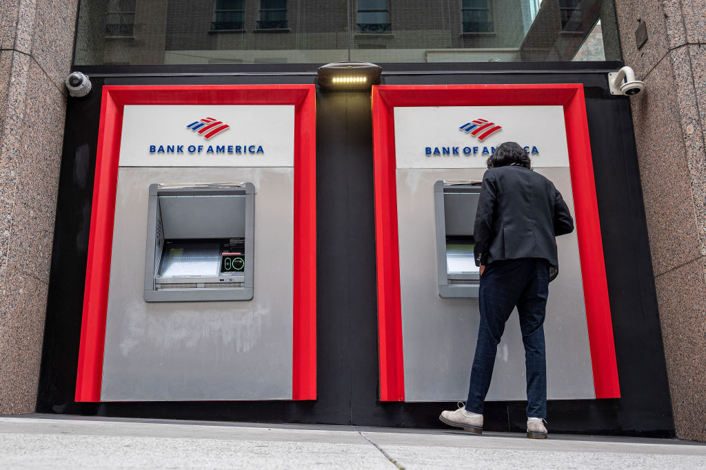 A customer uses an automated teller machine at a Bank of America branch in San Francisco.