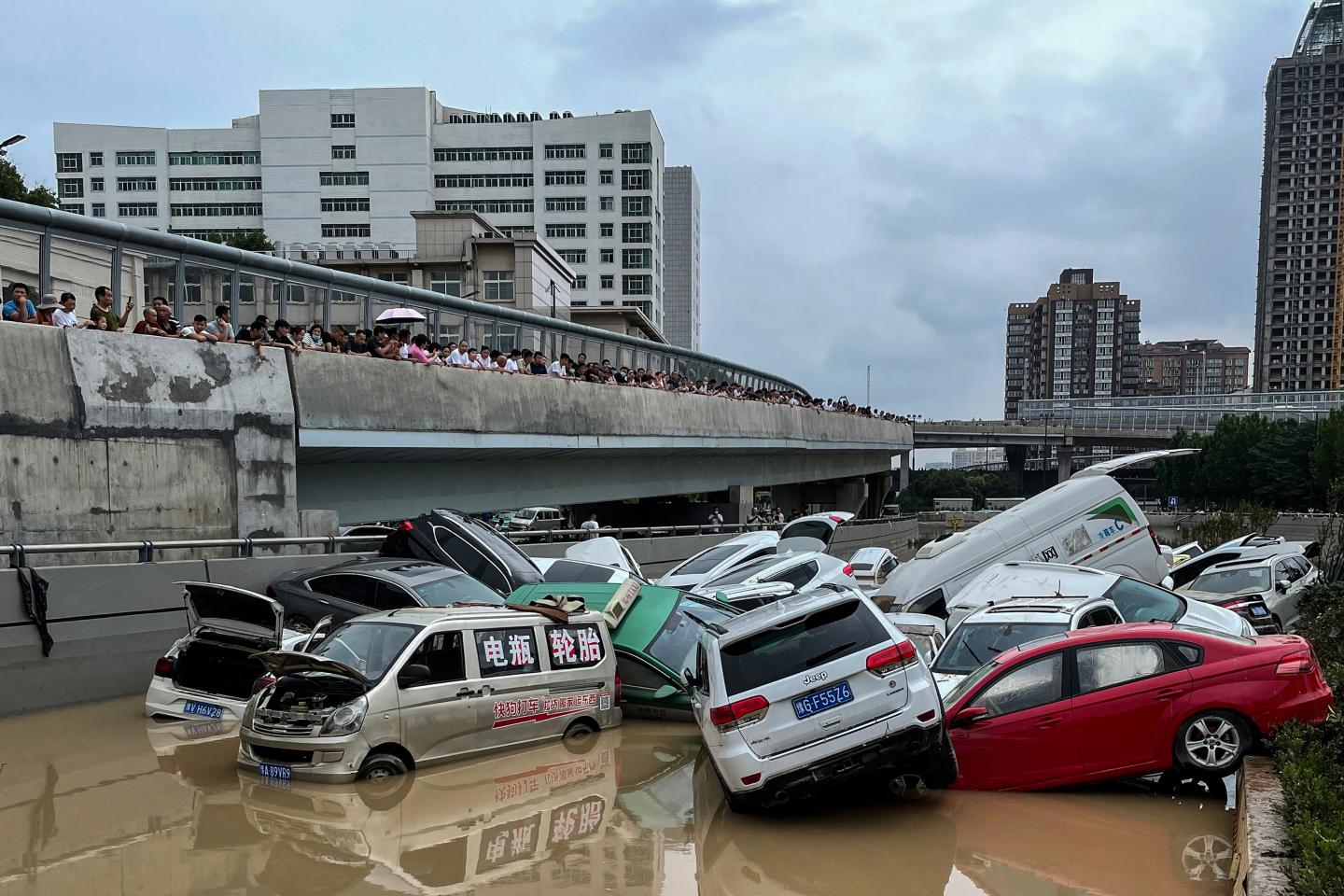 Cars sit in floodwaters after heavy rains hit the city of Zhengzhou in China's central Henan province on July 21, 2021.