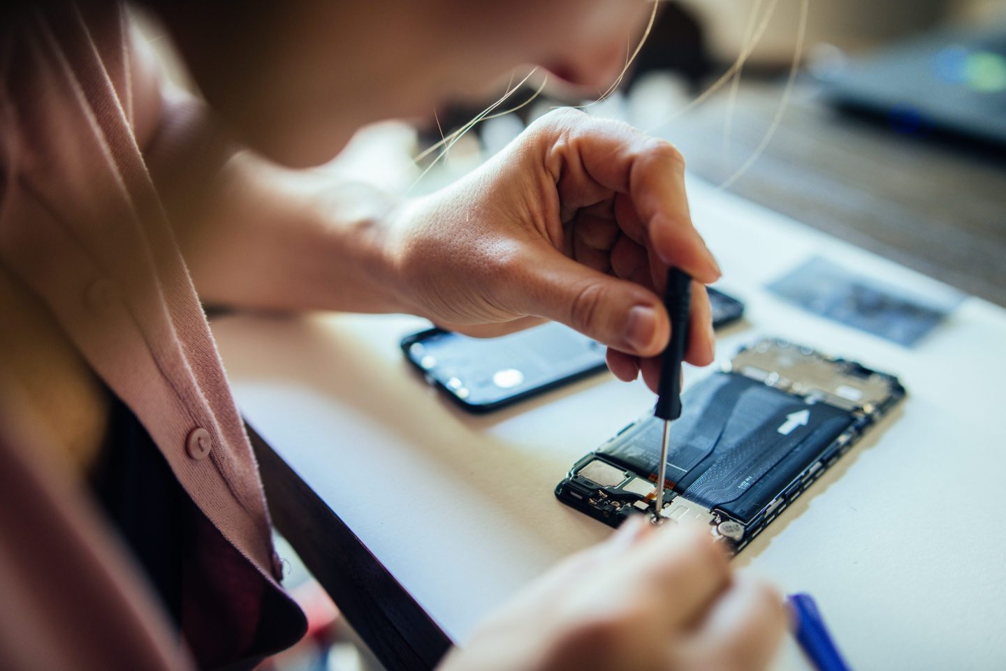 Woman repairing a phone