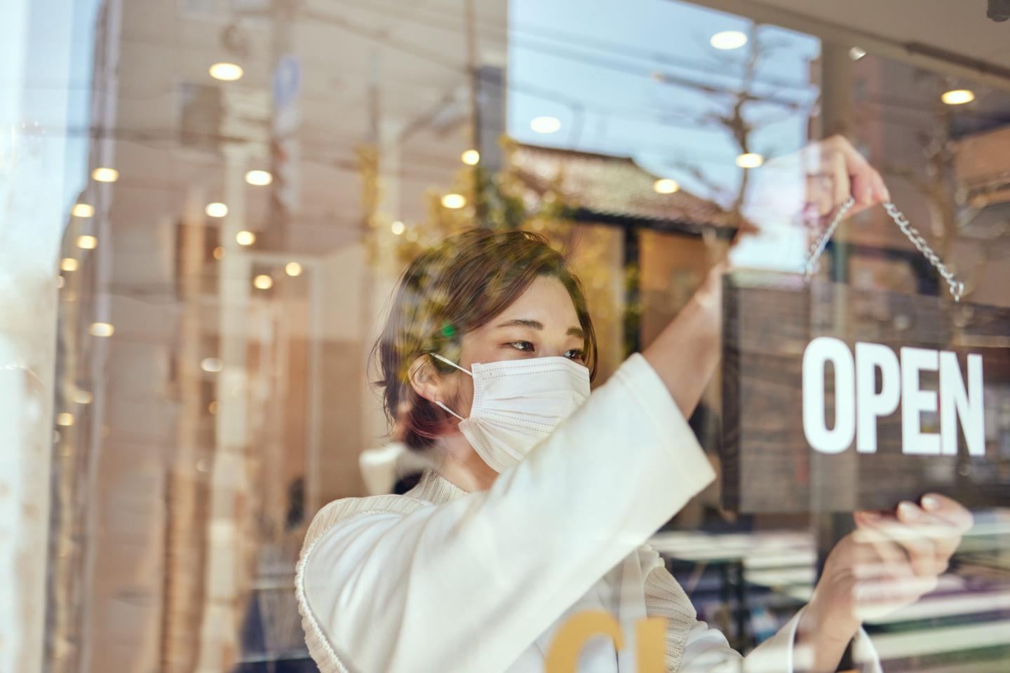 Woman opening a shop