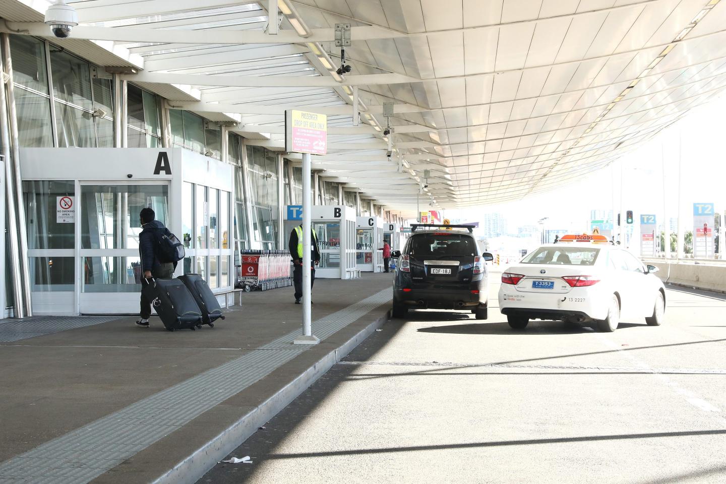Australia to cut international arrivals by half as it battles delta-variant outbreak