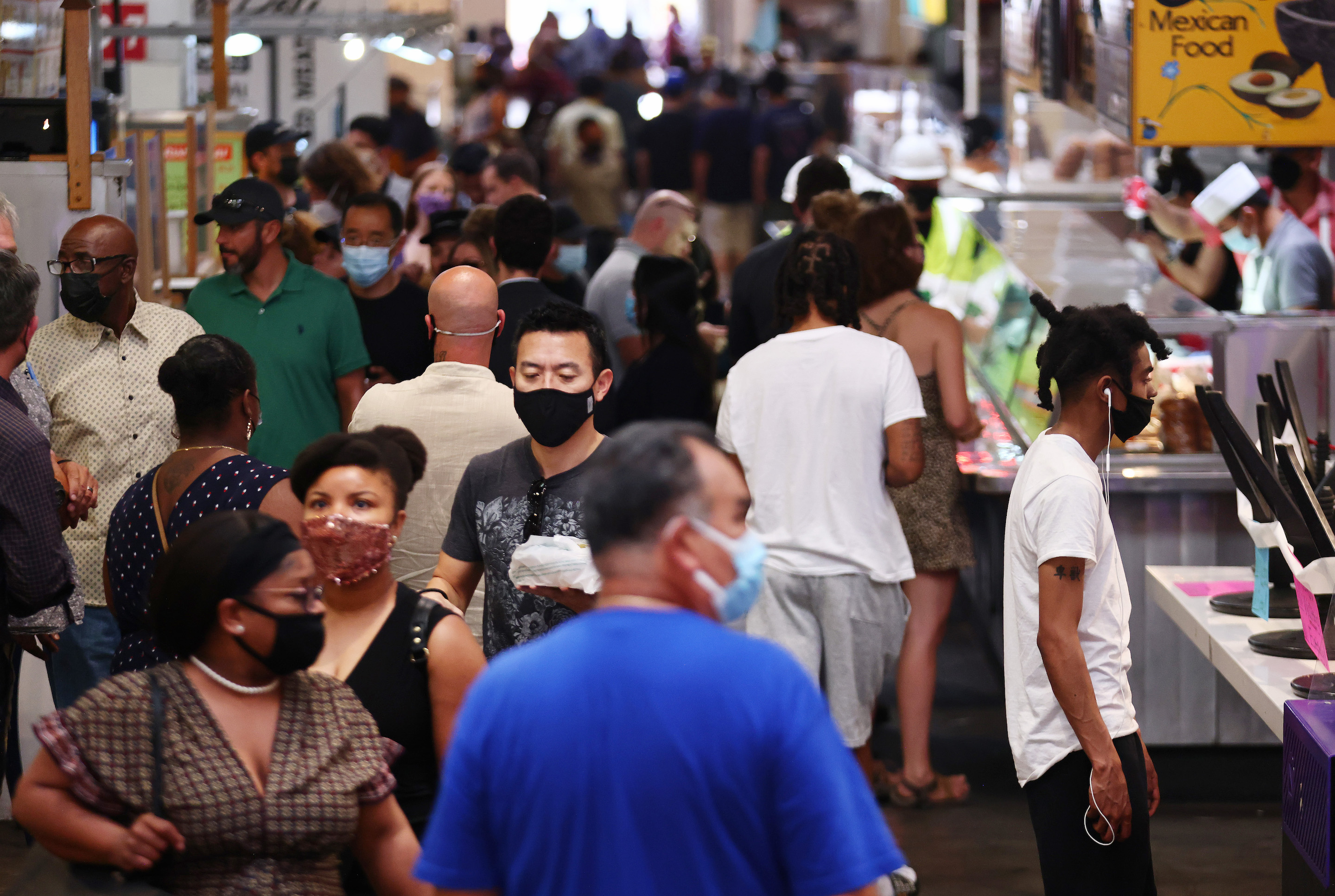 People wear face coverings in Grand Central Market on July 19, 2021 in Los Angeles.
