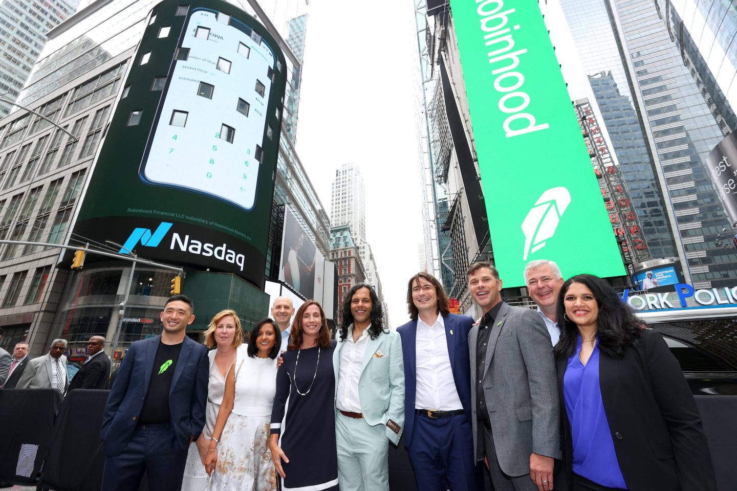 Robinhood executives stand outside of Nasdaq on July 29.