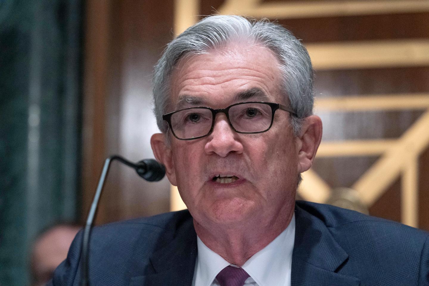 Federal Reserve’s plans to dial back on support are complicated by inflation and a COVID surge