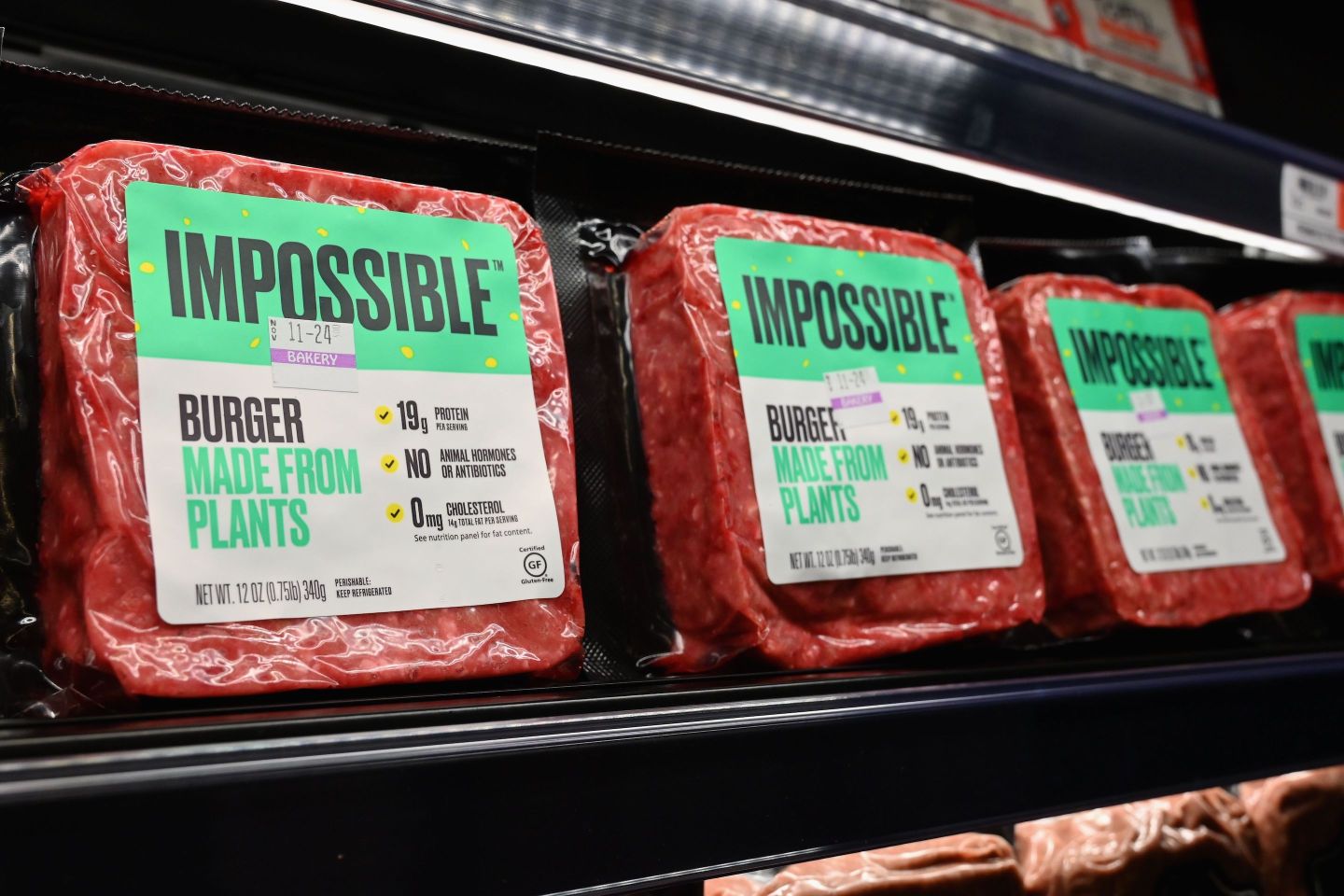 "Impossible Foods" burgers made from plant-based substitutes for meat products sit on a shelf for sale on November 15, 2019 in New York City.