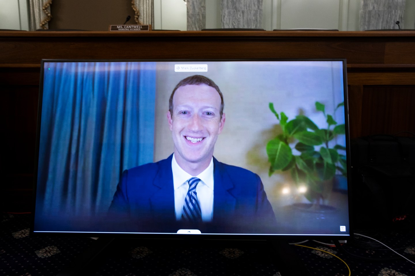 CEO of Facebook Mark Zuckerberg appears on a monitor as he testifies remotely during the Senate Commerce, Science, and Transportation Committee hearing 'Does Section 230's Sweeping Immunity Enable Big Tech Bad Behavior?', on Capitol Hill, October 28, 2020 in Washington, DC.