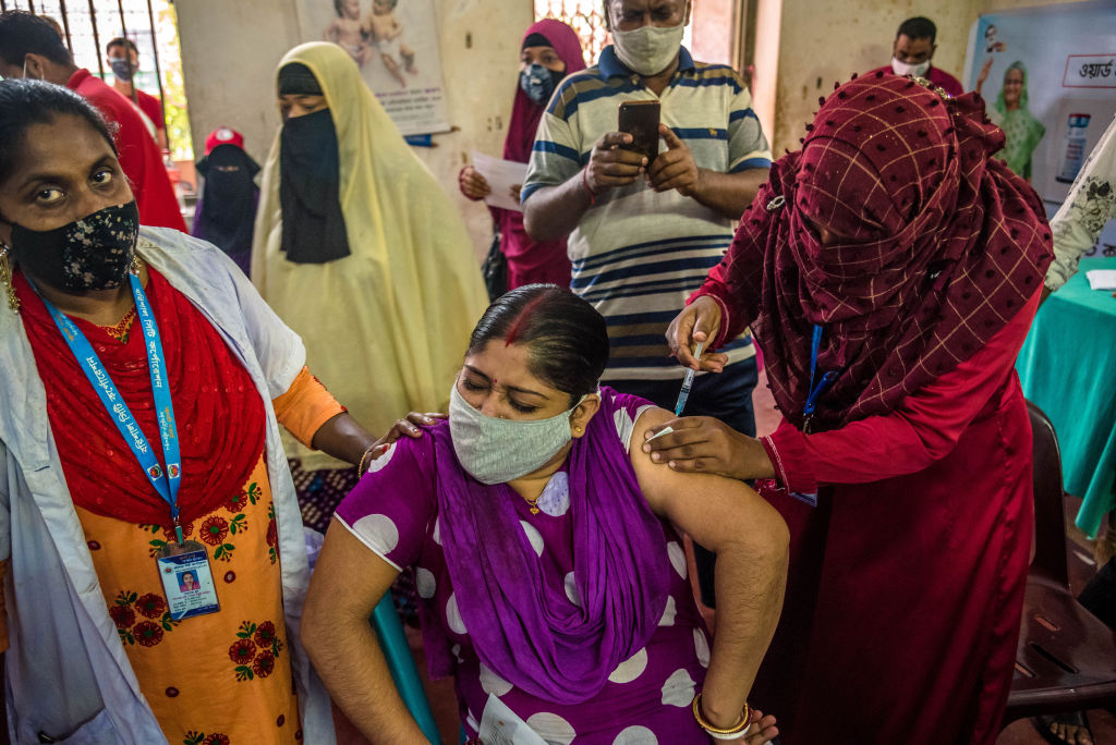 A woman in Bangladesh receiving a COVID-19 vaccine