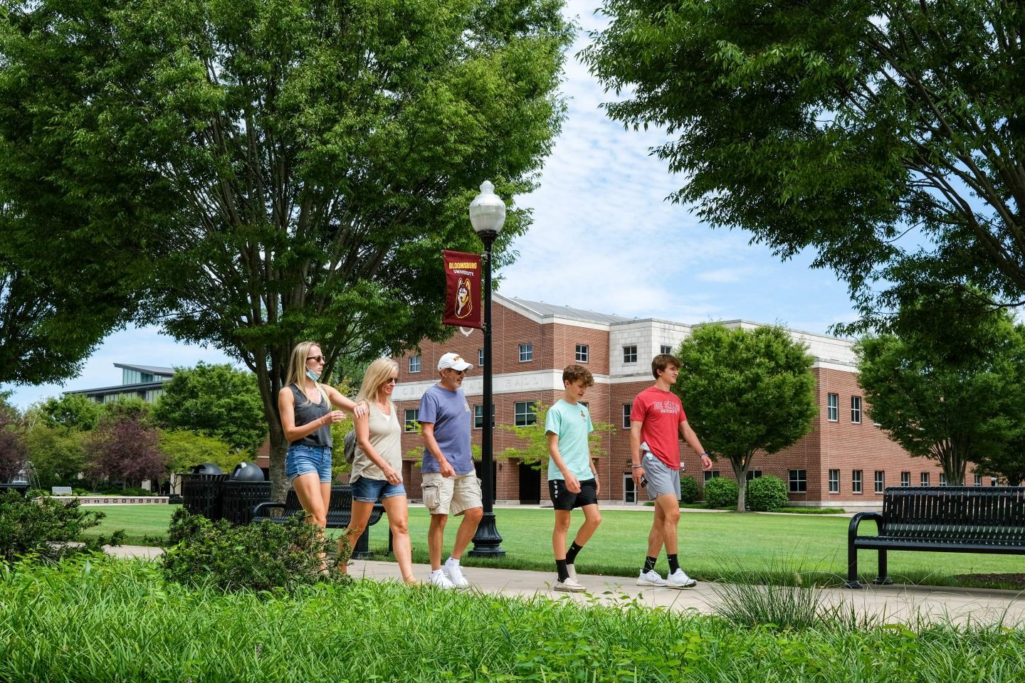 A family walking around a college campus