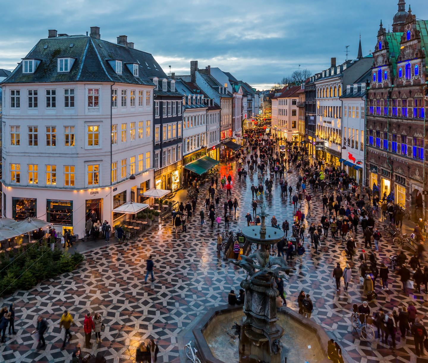 Denmark, Sjelland, Copenhagen . Amagertorv (Amager Square), the Stork Fountain and Strøget street, the main shopping street in Copenhagen