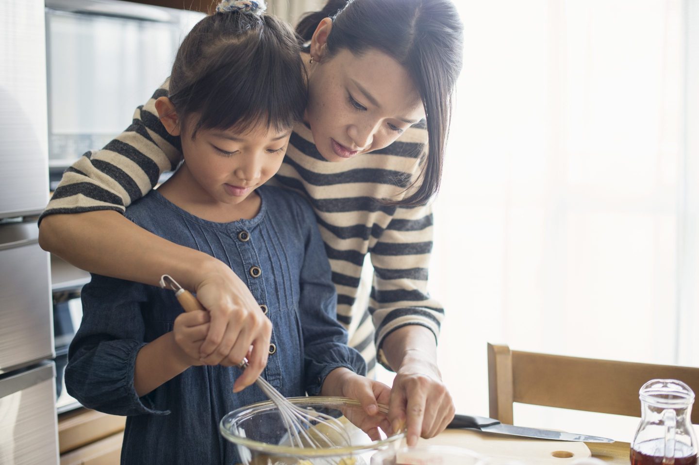 Mother and daughter cooking