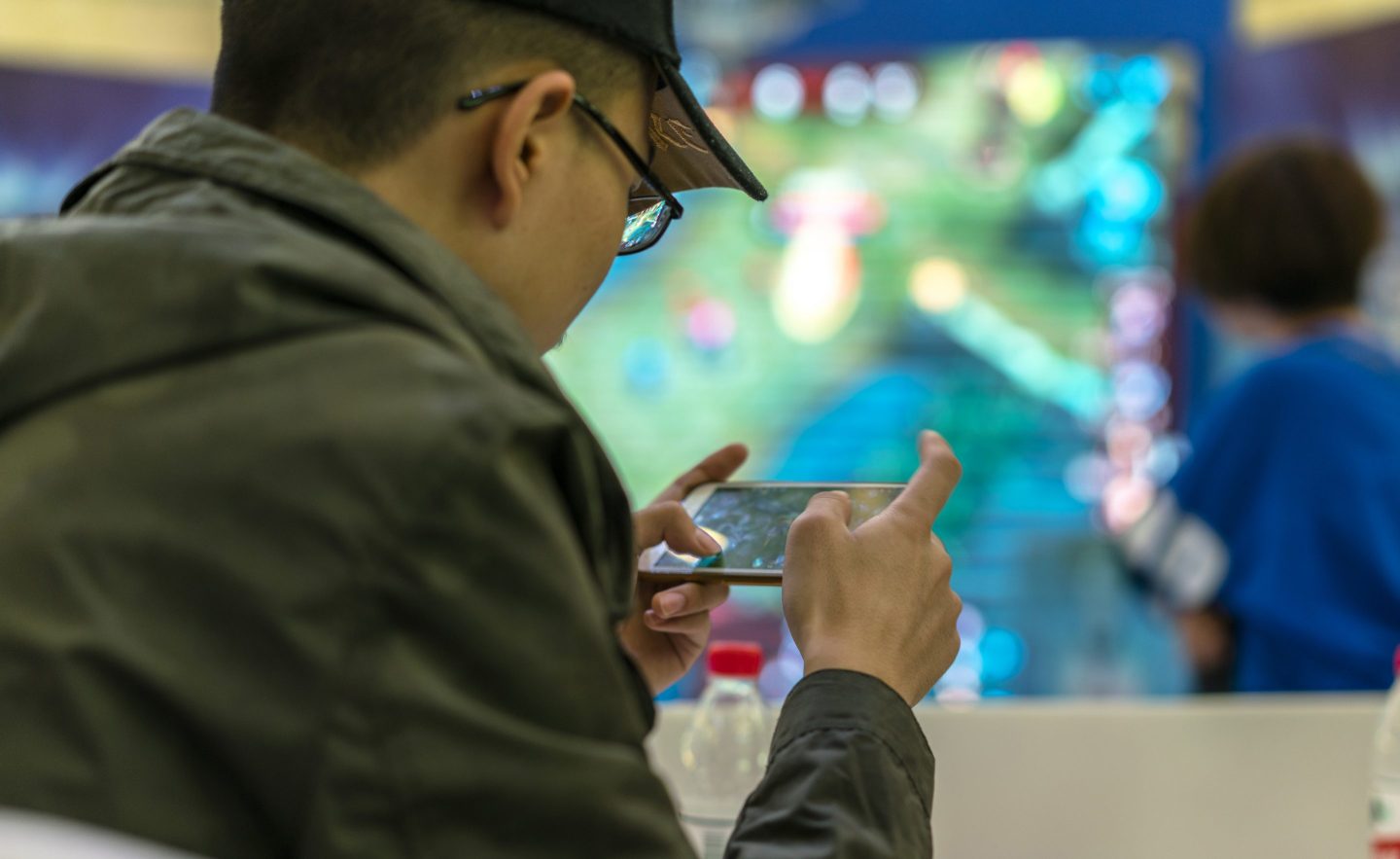 Young players compete in a battle match of the mobile game