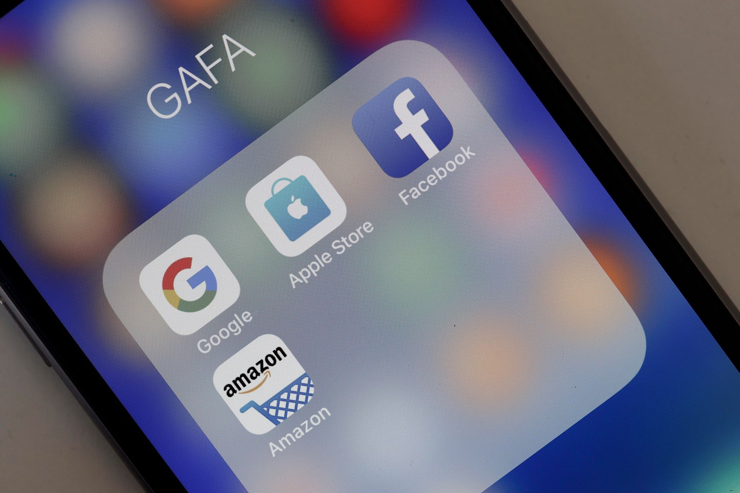 In this photo illustration, logos of the Google, Apple, Facebook, and Amazon applications (GAFA) are displayed on the screen of an Apple iPhone on May 31, 2018 in Paris, France.
