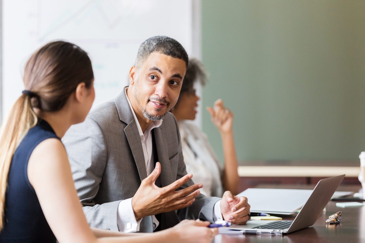 Businessman has a discussion sitting next to a colleague