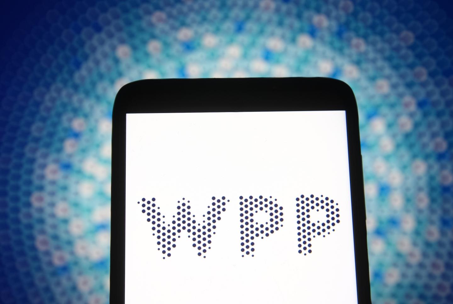 In this photo illustration a WPP logo of a British communication company is seen on a smartphone screen.