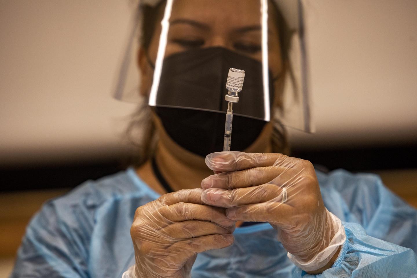 Vaccine mandates pick up steam, but few employers say they’ll fire violators