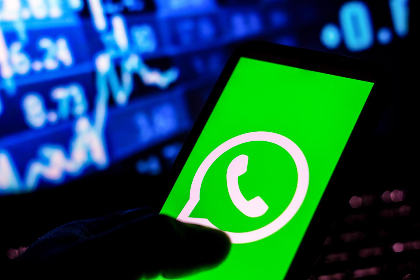In this photo illustration the WhatsApp logo seen displayed on a smartphone.