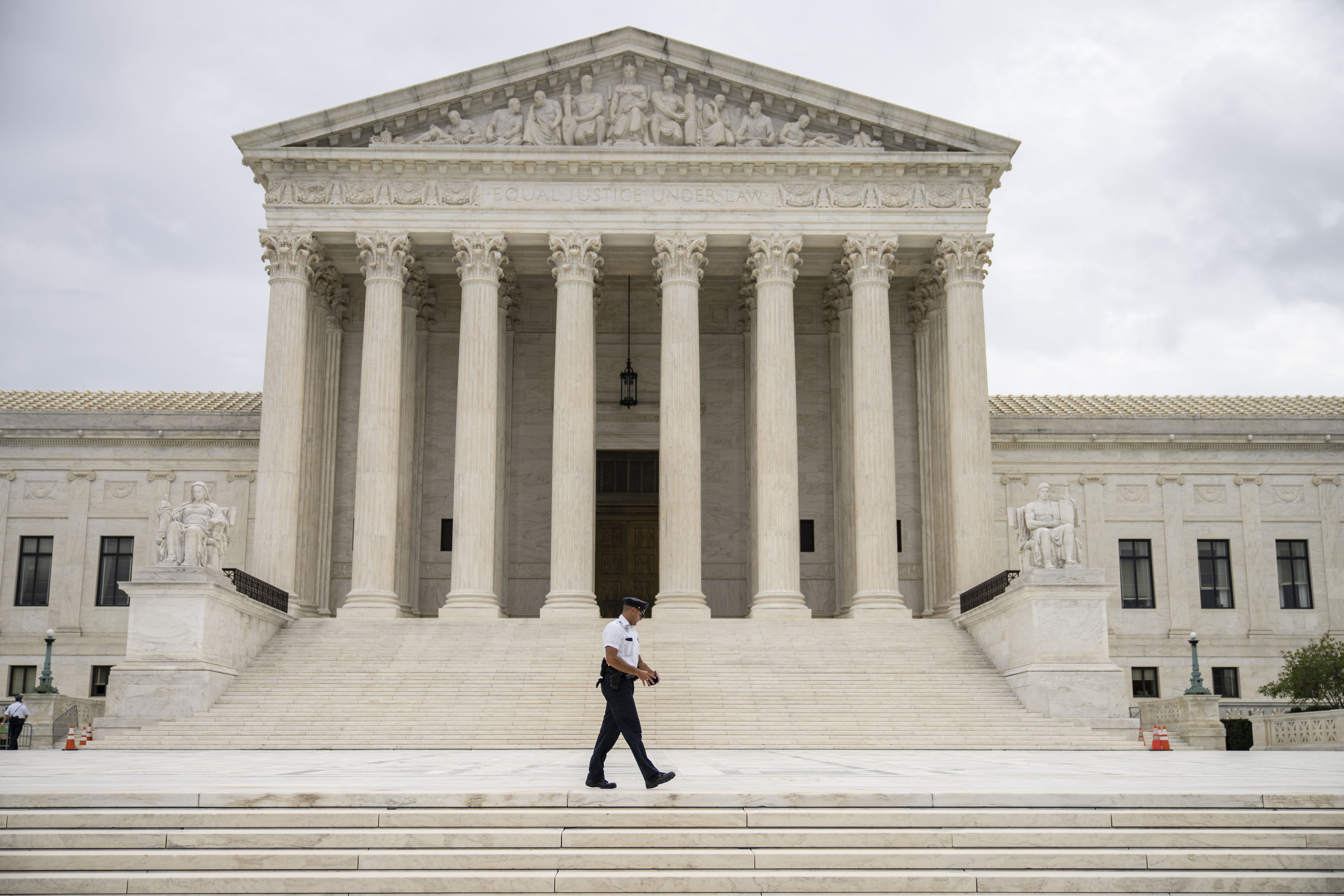 A Supreme Court Police officer patrols at the U.S. Supreme Court on September 1, 2021 in Washington, DC. A new Texas law that prohibits most abortions after six weeks of pregnancy went into effect on Wednesday. The U.S. Supreme Court did not act on a request to block the law. 